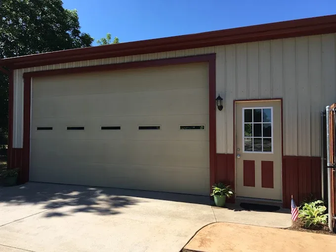 Flush panel garage door on metal building installed by Affordable Door Co OKC metro
